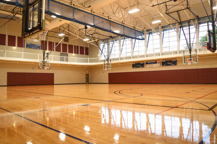 Full size gym with basketball hoops