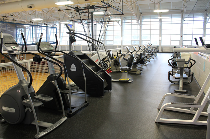 bridge area with stationary bikes and stair machines
