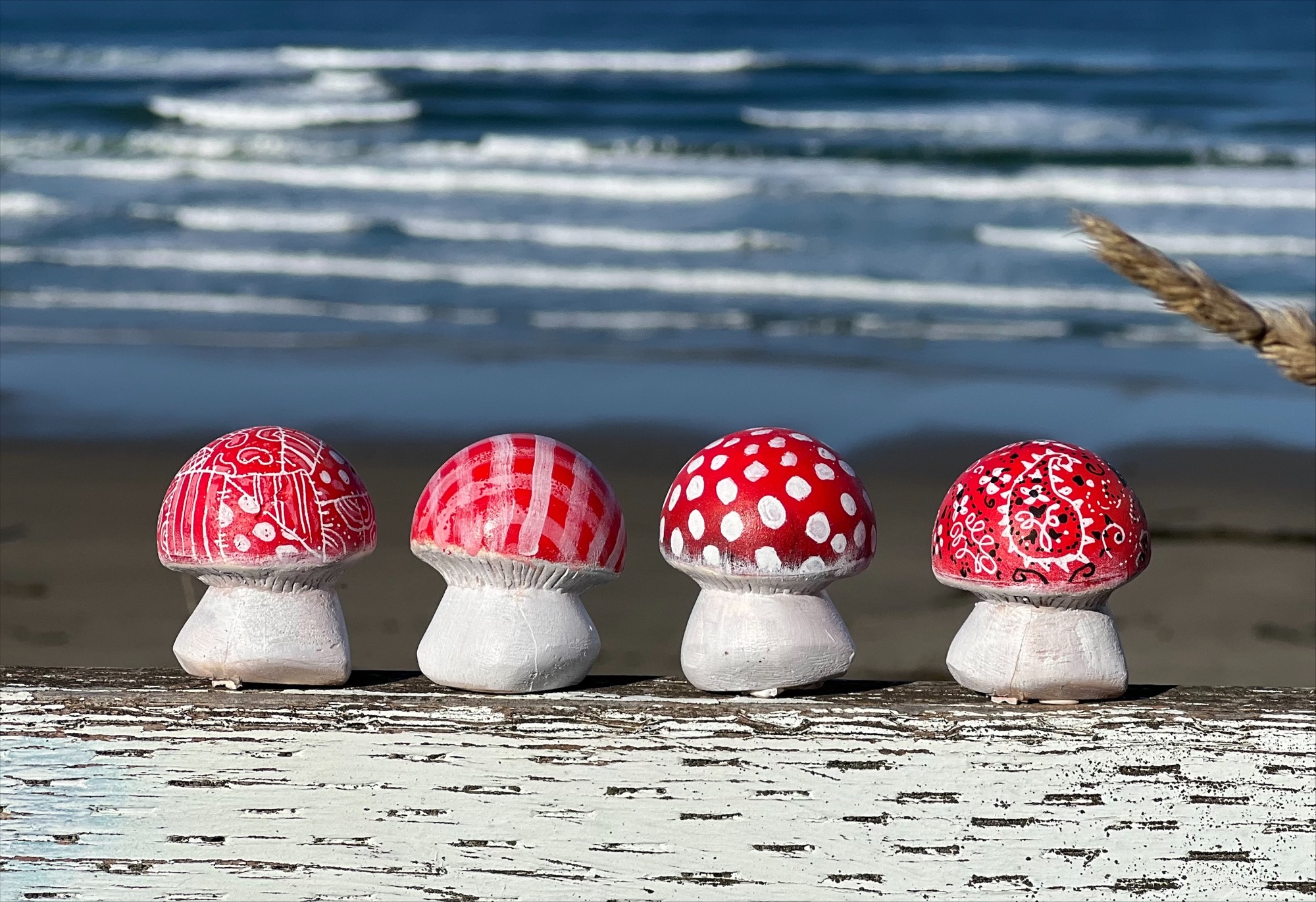 mushroom art in front of the ocean