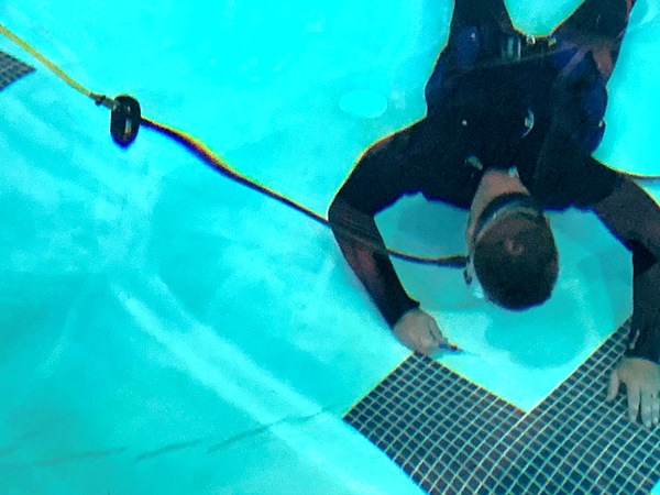 diver performing pool inspection